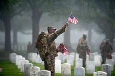 US-soldiers-place-flags-graves-Arlington-National-Cemetery-Virginia-Memorial-Day-2019.jpg